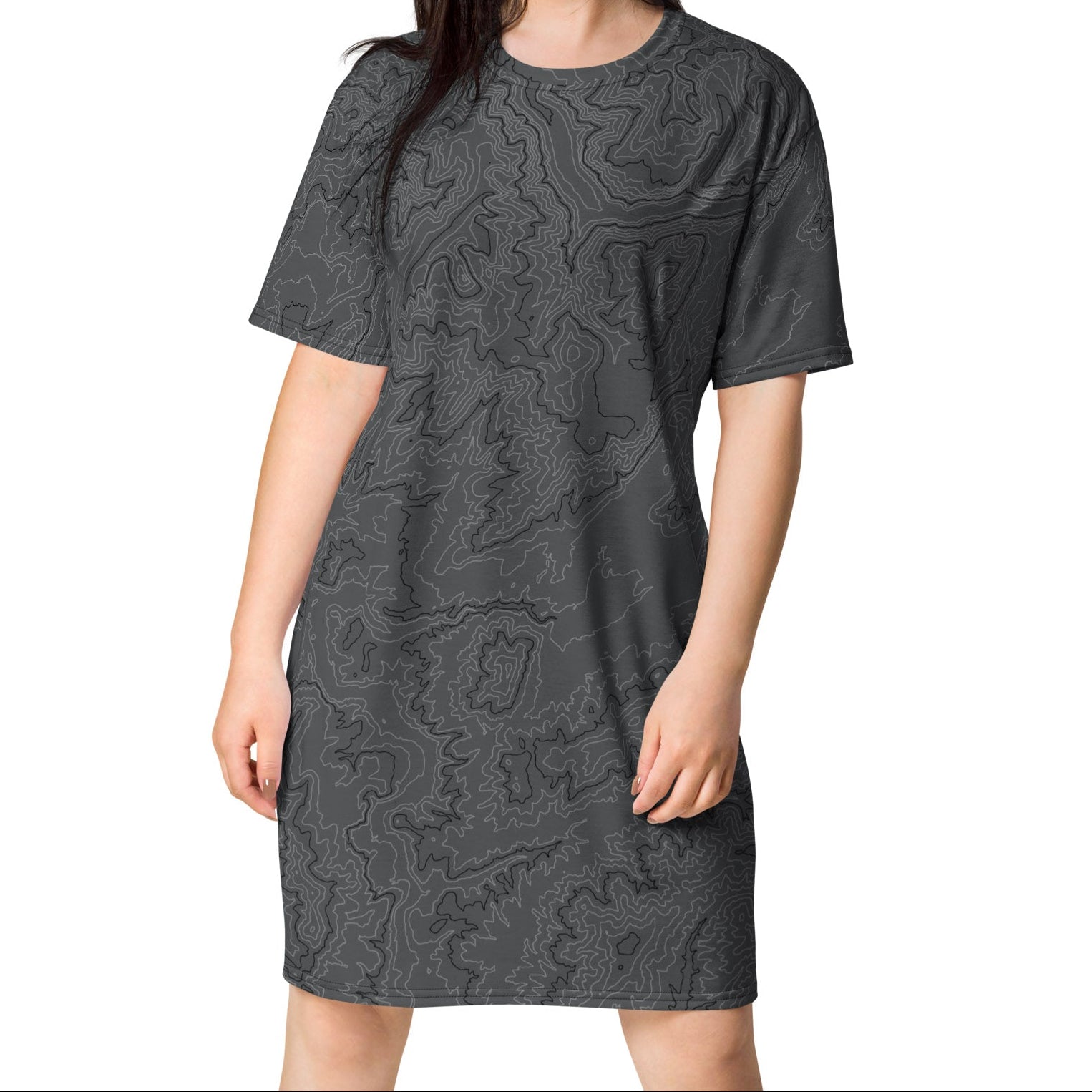 Woman wearing a gray patterned dress on a white background