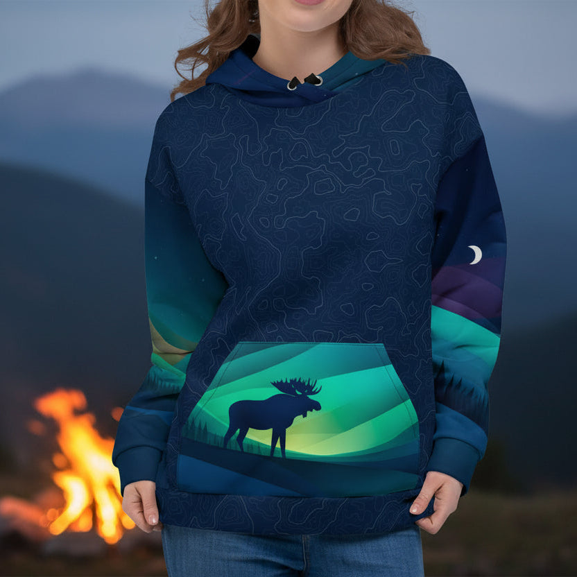 Woman wearing a blue hoodie with a moose design on a white background